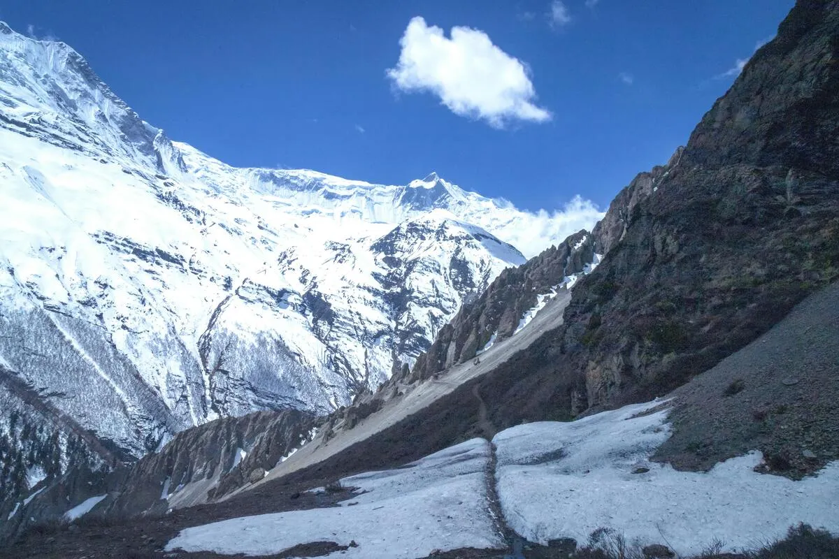 Melting Himalayan glacier with visible ice loss and flowing meltwater