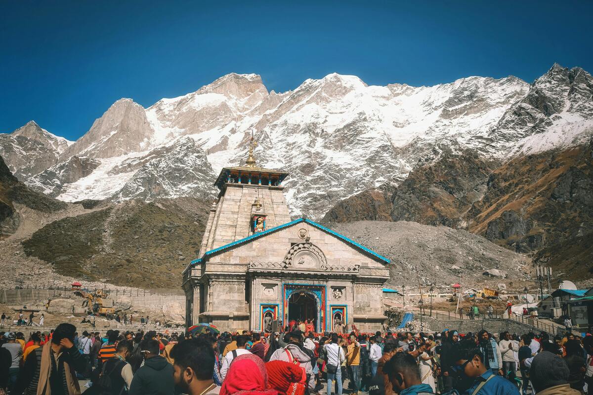 Kedarnath Temple with pilgrims and flood debris behind the temple after the 2013 disaster